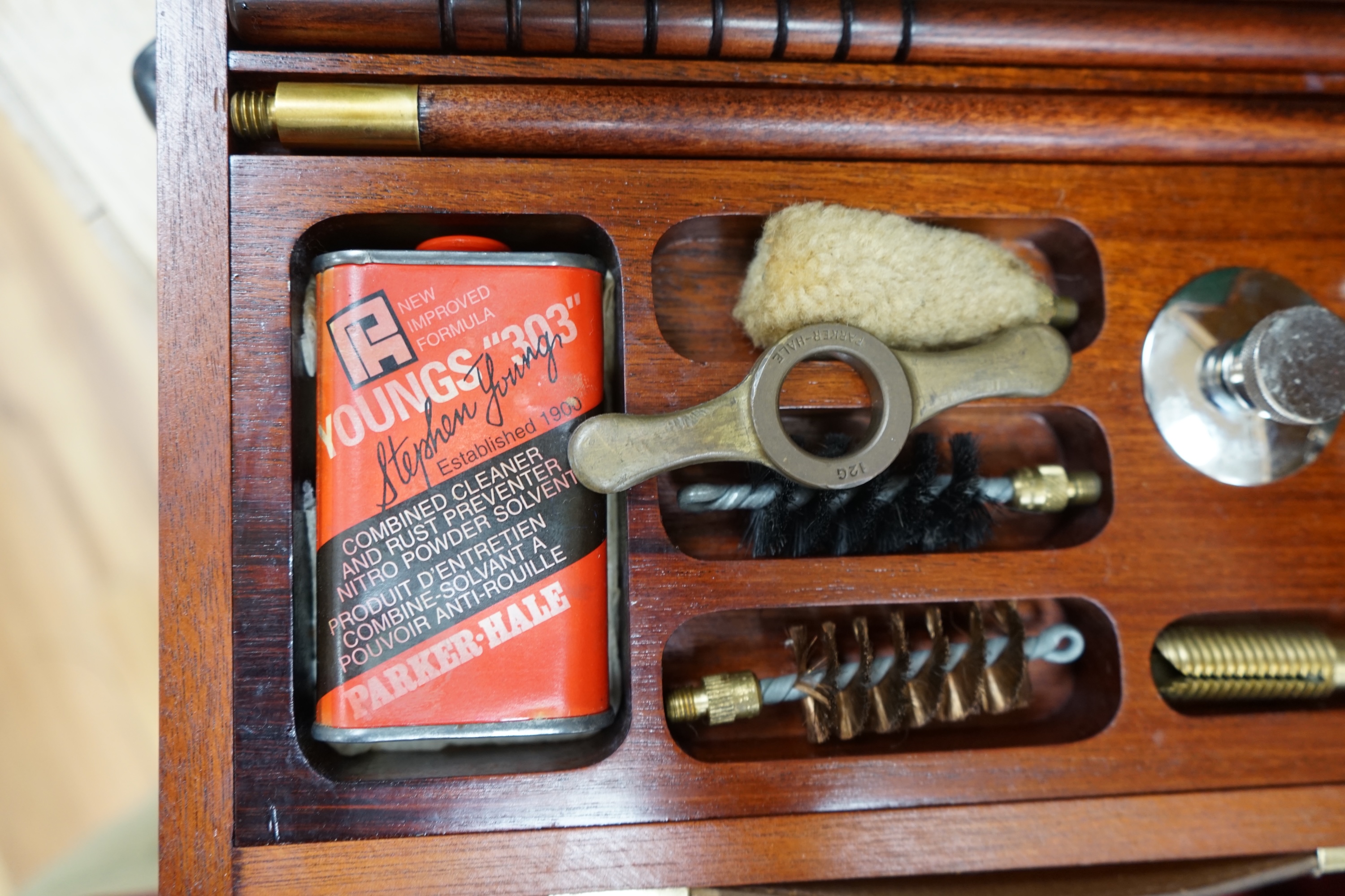 Two cases of gun cleaning equipment and a 19th century leather gun case, 83cm long. Condition - fair to good